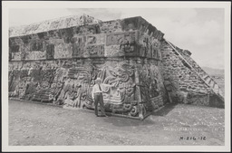 Edgar Hewett leaning against ruins in Xochicalco, Mexico