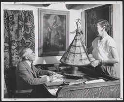 Hon. Boaz Long is shown a recent acquisition of Spanish Colonial art by curator E. Boyd.