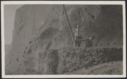 Edgar L. Hewett at top of Kiva in Ceremonial Cave at Rito de los Frijoles (Bandelier National Monument)